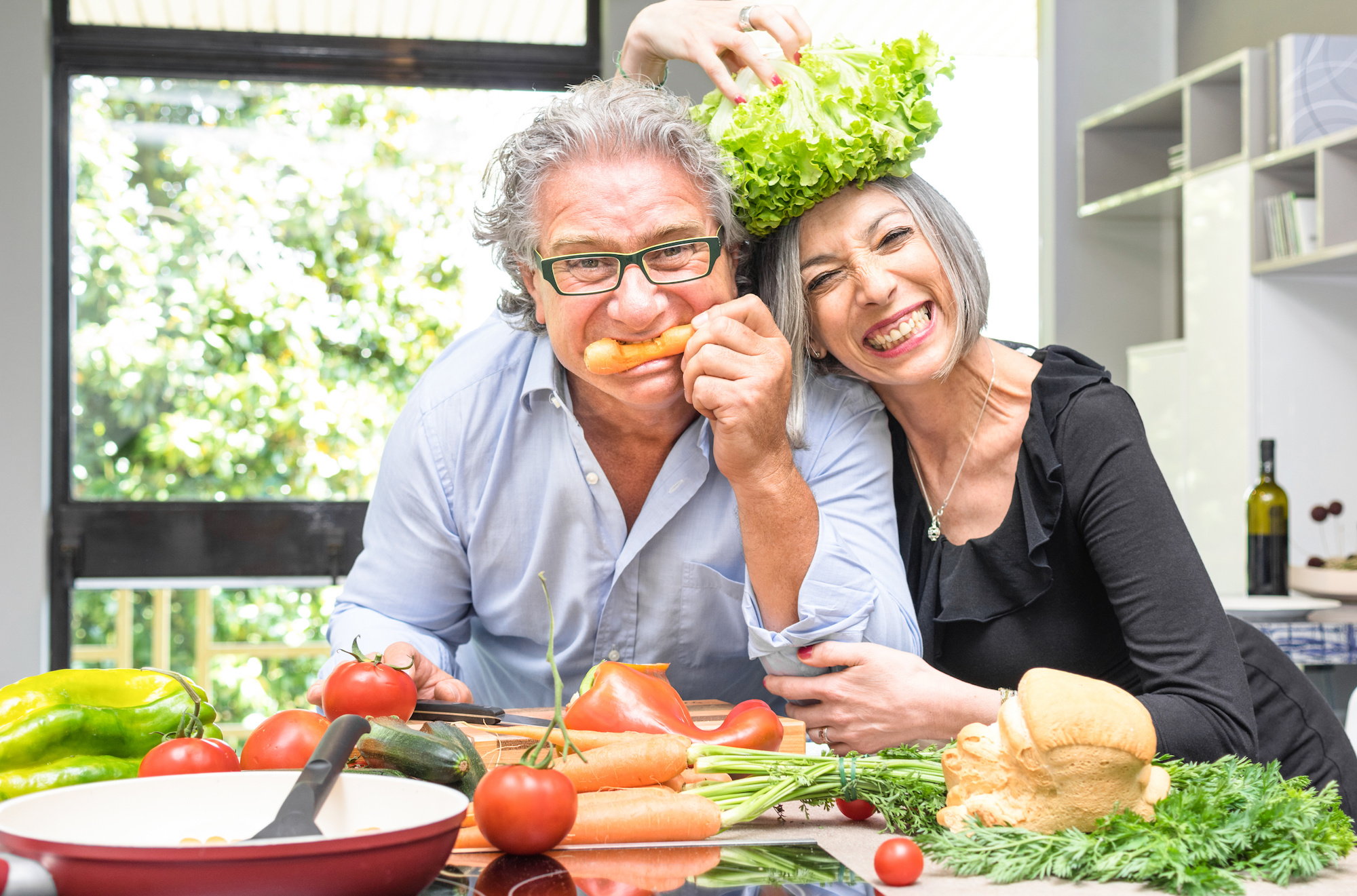 A senior couple incorporating vegetables into their diet in order to live a healthier lifestyle